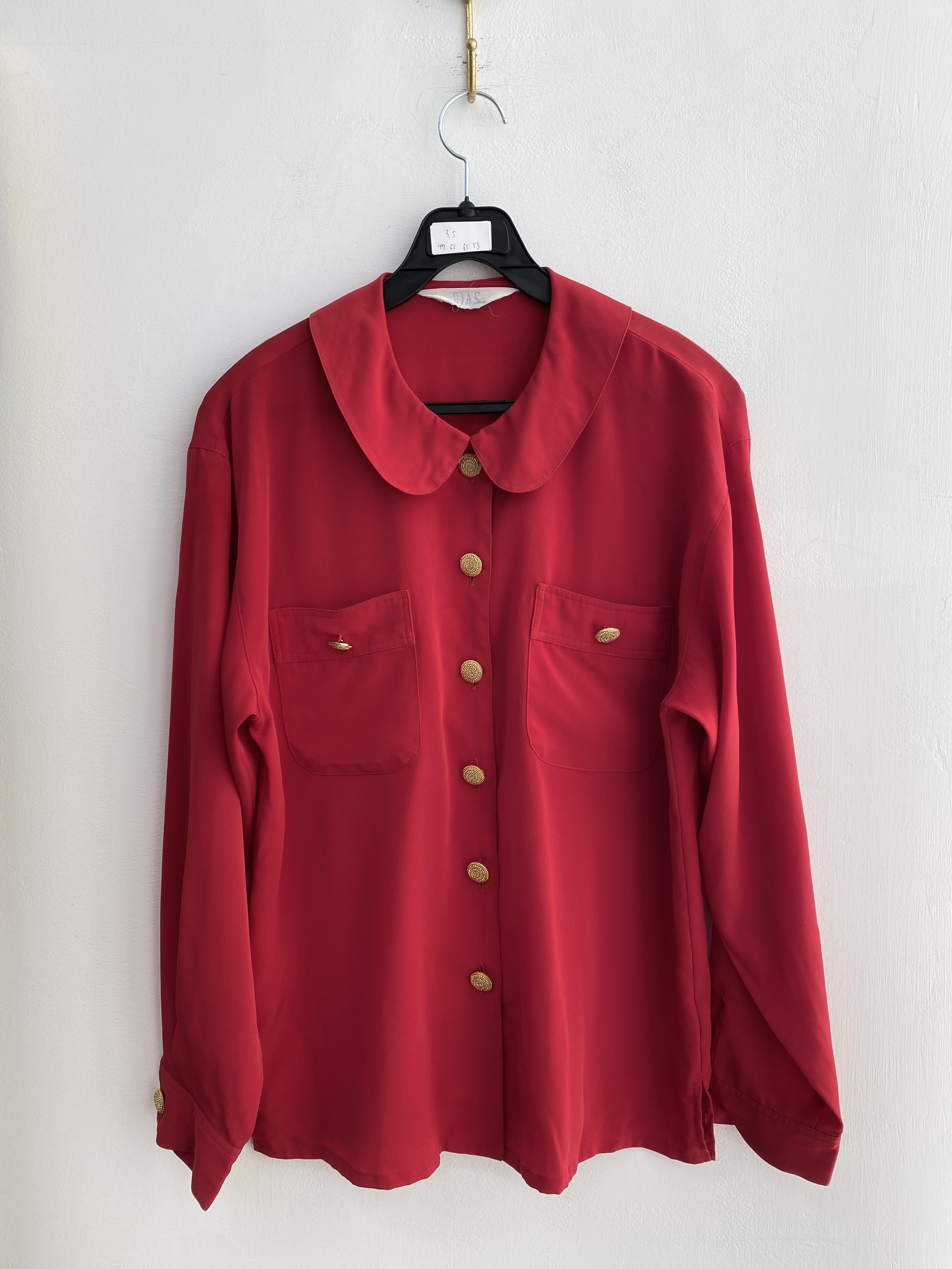 Red two pocket gold button poly shirt blouse