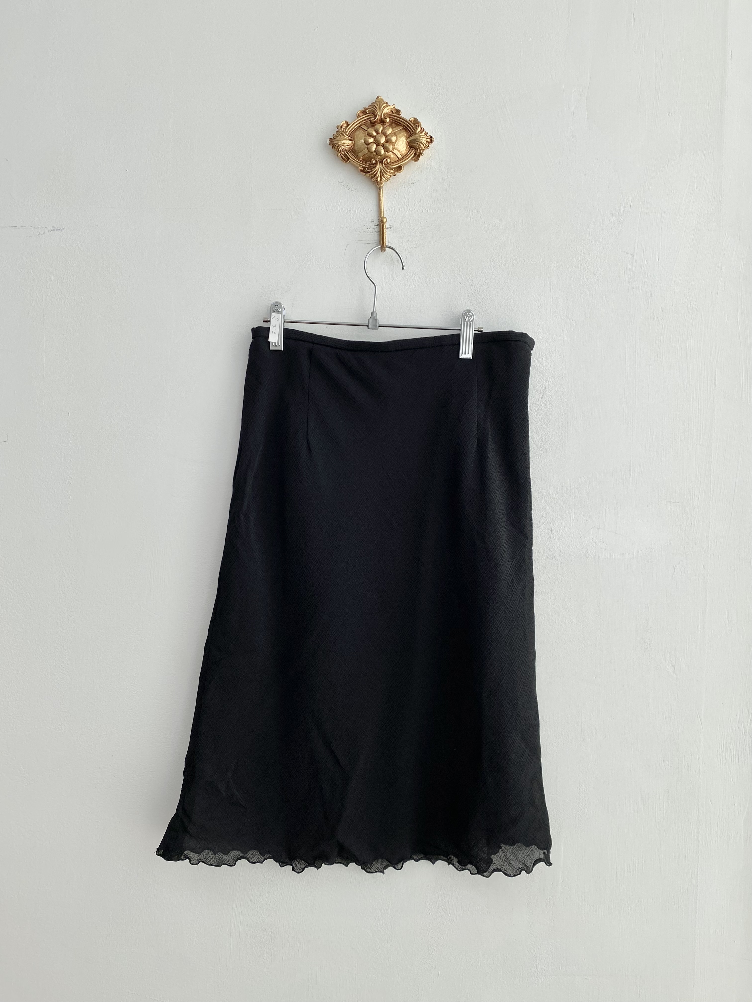 Black poly ruffle point mid skirt